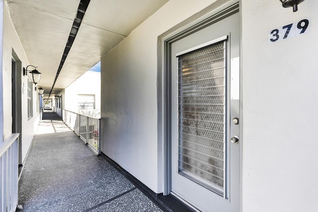 entrance to property with a balcony