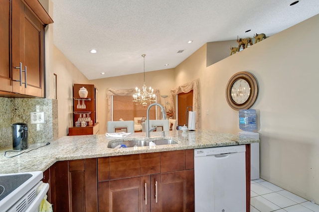 kitchen featuring sink, tasteful backsplash, a chandelier, white dishwasher, and light stone countertops