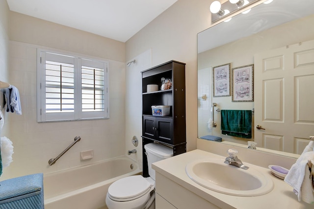 full bathroom featuring vanity, bathtub / shower combination, and toilet