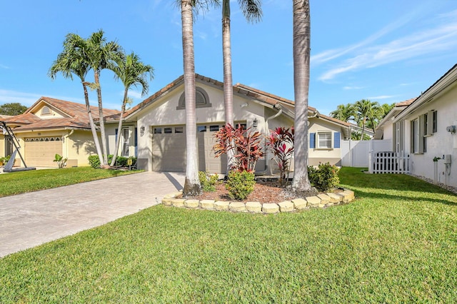 view of front of house featuring a garage and a front yard