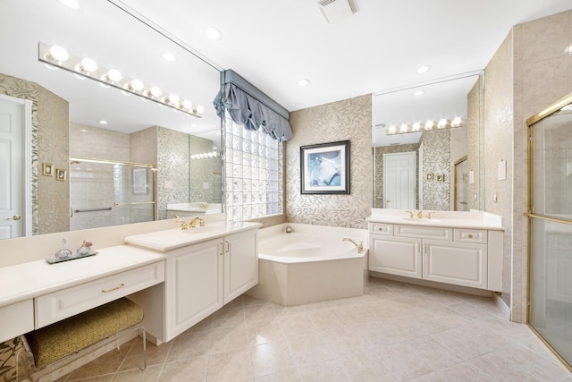 bathroom with vanity, tile patterned floors, and plus walk in shower