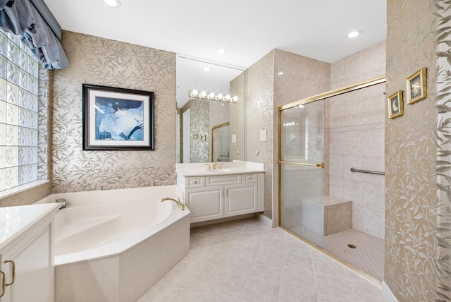 bathroom with vanity, tile patterned floors, and separate shower and tub