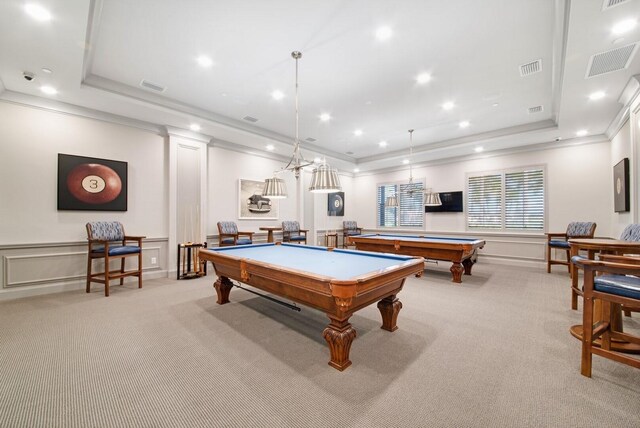 rec room featuring ornamental molding, billiards, light colored carpet, and a tray ceiling