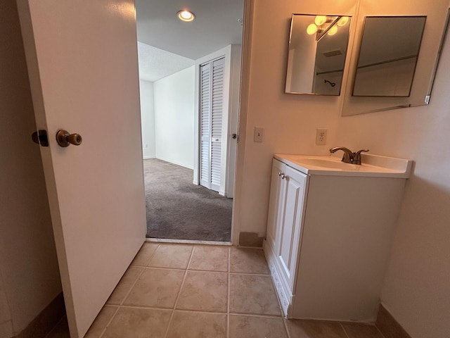 bathroom with vanity and tile patterned floors