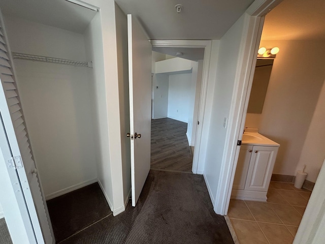 hallway featuring tile patterned floors