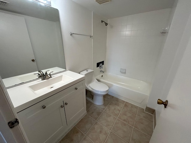 full bathroom featuring vanity, tiled shower / bath combo, tile patterned floors, and toilet