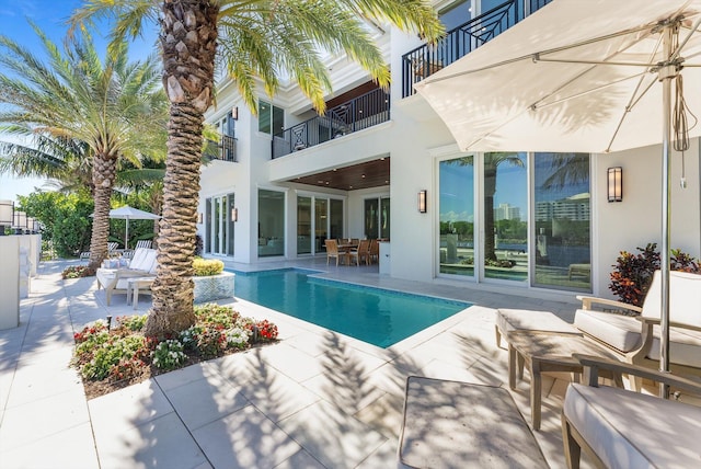 outdoor pool featuring a patio