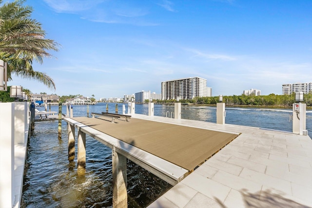 dock area with a water view and a city view