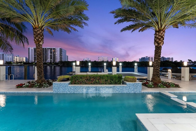 pool featuring a view of city and a patio