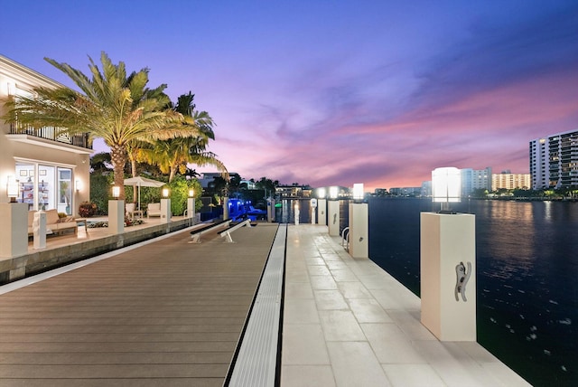 dock area featuring a water view and a city view