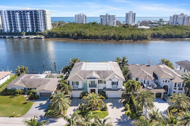 bird's eye view featuring a water view and a city view