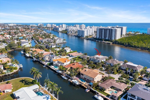 drone / aerial view with a water view and a residential view