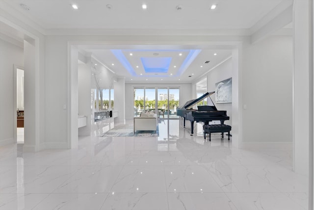 living area featuring ornamental molding, baseboards, and marble finish floor