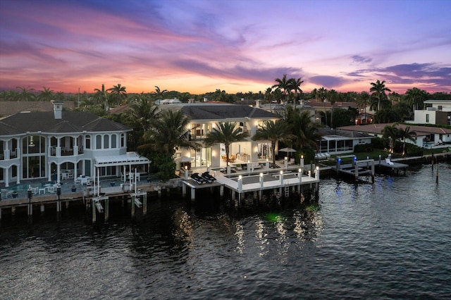 dock area with a water view and boat lift