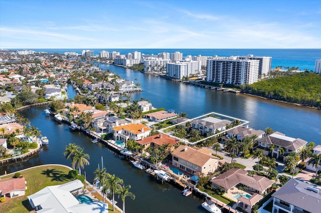 drone / aerial view featuring a water view and a residential view