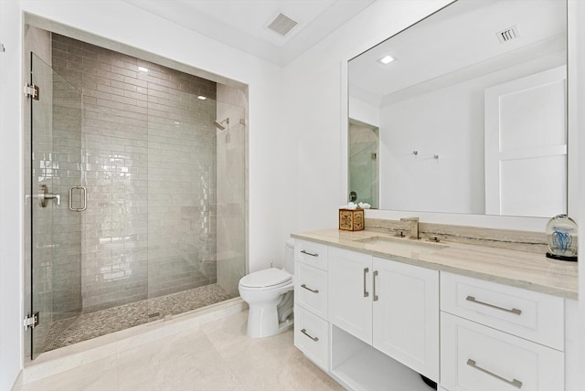 bathroom featuring toilet, a stall shower, vanity, and visible vents