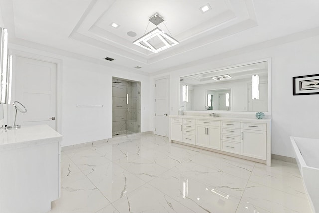 bathroom featuring baseboards, marble finish floor, a stall shower, vanity, and a tray ceiling