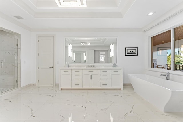 full bathroom with a freestanding bath, a marble finish shower, a tray ceiling, marble finish floor, and vanity