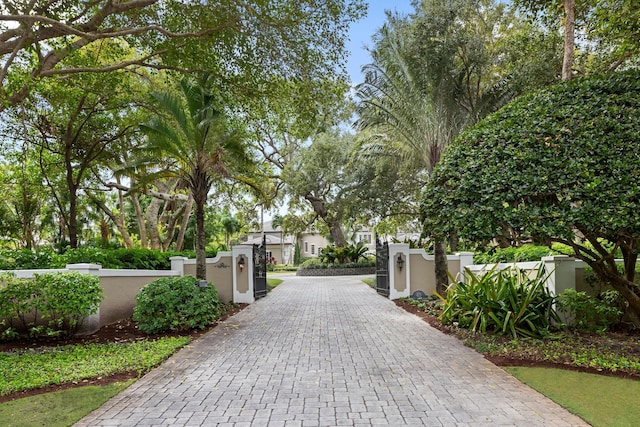 view of gate featuring a fenced front yard