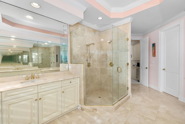 full bathroom featuring recessed lighting, ornamental molding, a stall shower, vanity, and baseboards