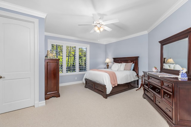 bedroom featuring ornamental molding, light colored carpet, baseboards, and a ceiling fan