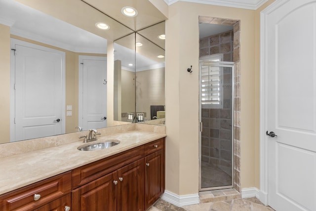 full bath featuring recessed lighting, ornamental molding, a shower stall, vanity, and baseboards