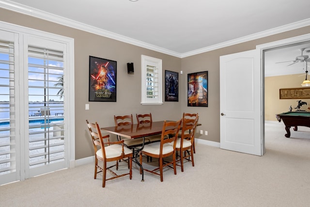 dining space with baseboards, light colored carpet, ceiling fan, pool table, and crown molding