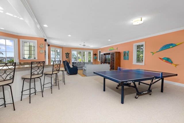 rec room with ornamental molding, carpet flooring, and recessed lighting