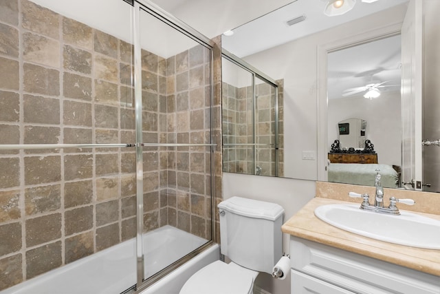 full bathroom with enclosed tub / shower combo, ceiling fan, toilet, vanity, and visible vents