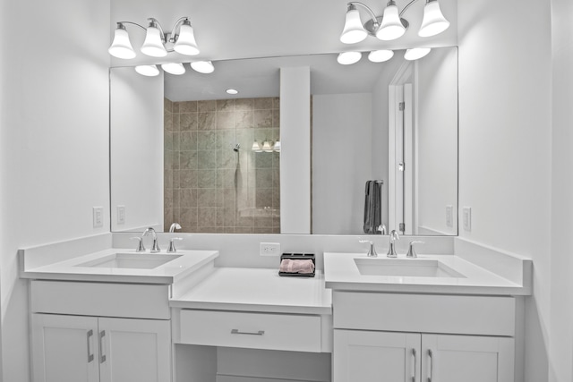 bathroom with vanity and a tile shower