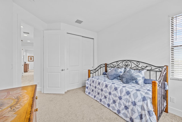 bedroom with a closet and carpet