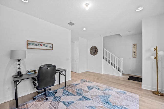 office with light hardwood / wood-style floors