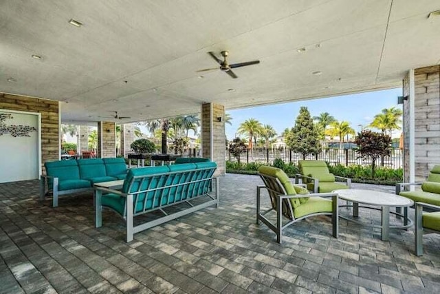 view of patio featuring an outdoor hangout area and ceiling fan