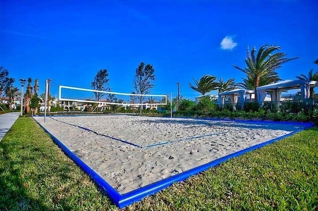 view of home's community featuring volleyball court