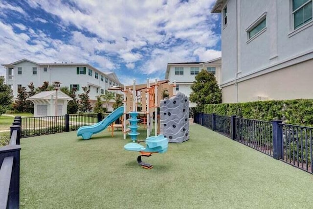 view of play area featuring a lawn