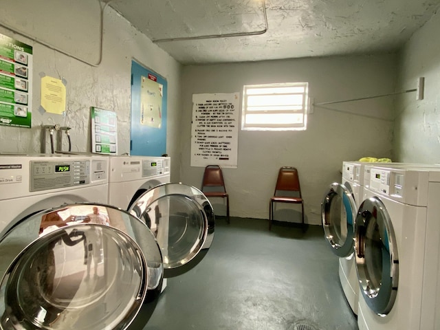 clothes washing area with washer and dryer