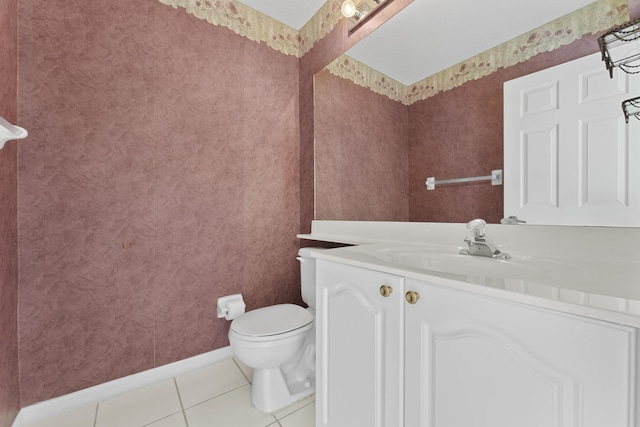 bathroom with vanity, tile patterned floors, and toilet