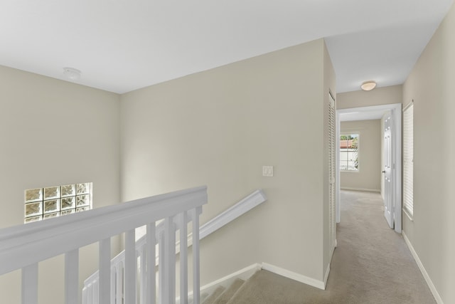 corridor with light colored carpet