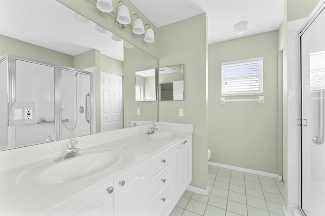 bathroom with vanity, an enclosed shower, tile patterned floors, and toilet