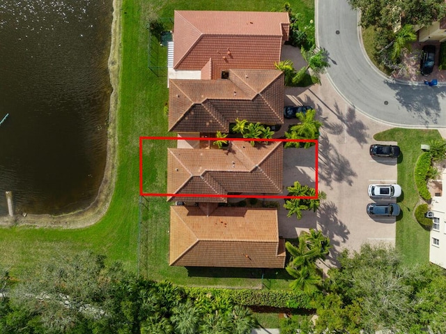 birds eye view of property featuring a water view