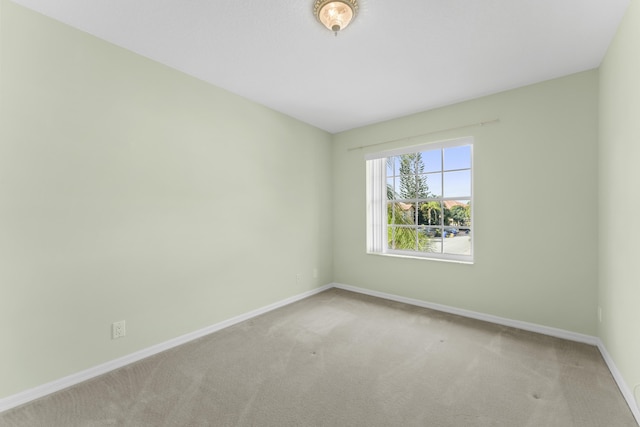 empty room featuring light colored carpet