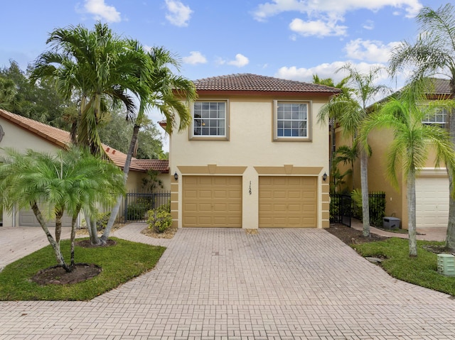 mediterranean / spanish house with a garage