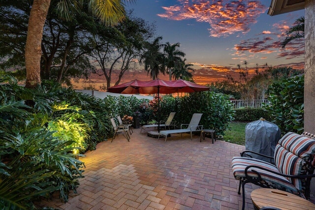 view of patio terrace at dusk