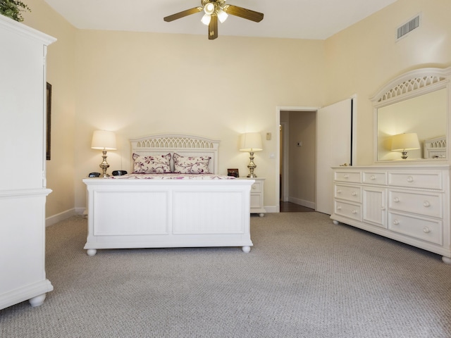 bedroom featuring light carpet and ceiling fan