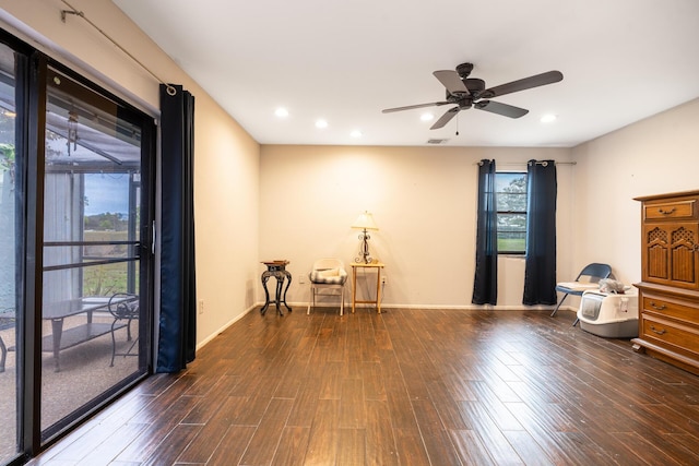 interior space with plenty of natural light, visible vents, dark wood finished floors, and baseboards