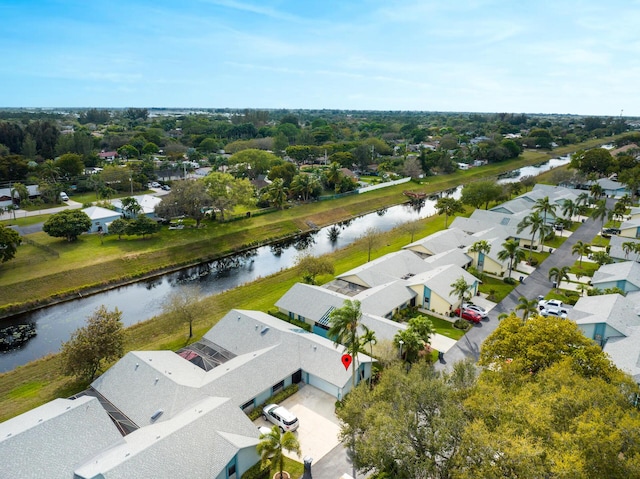 bird's eye view with a residential view and a water view