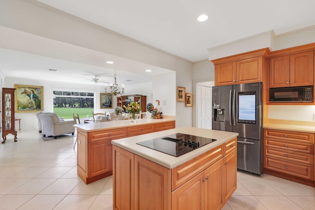 9 Par Club Cir, Village Of Golf, FL 33436 - kitchen with kitchen peninsula, black appliances, a center island, and light tile patterned floors