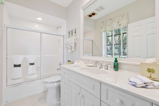 9 Par Club Cir, Village Of Golf, FL 33436 - full bathroom featuring tile patterned floors, bath / shower combo with glass door, vanity, and toilet