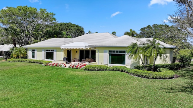 9 Par Club Cir, Village Of Golf, FL 33436 - rear view of property featuring a lawn