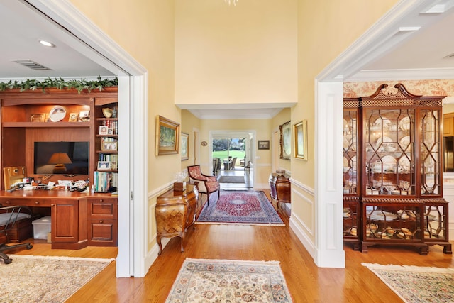 9 Par Club Cir, Village Of Golf, FL 33436 - entryway featuring light wood-type flooring, ornamental molding, and a towering ceiling